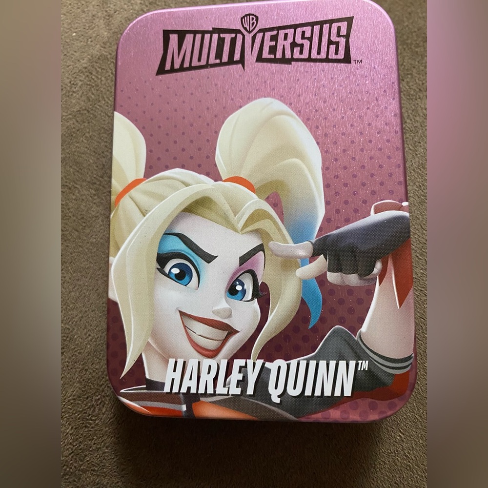 Multiversus Harley Quinn Tin Box includes a two sided puzzle